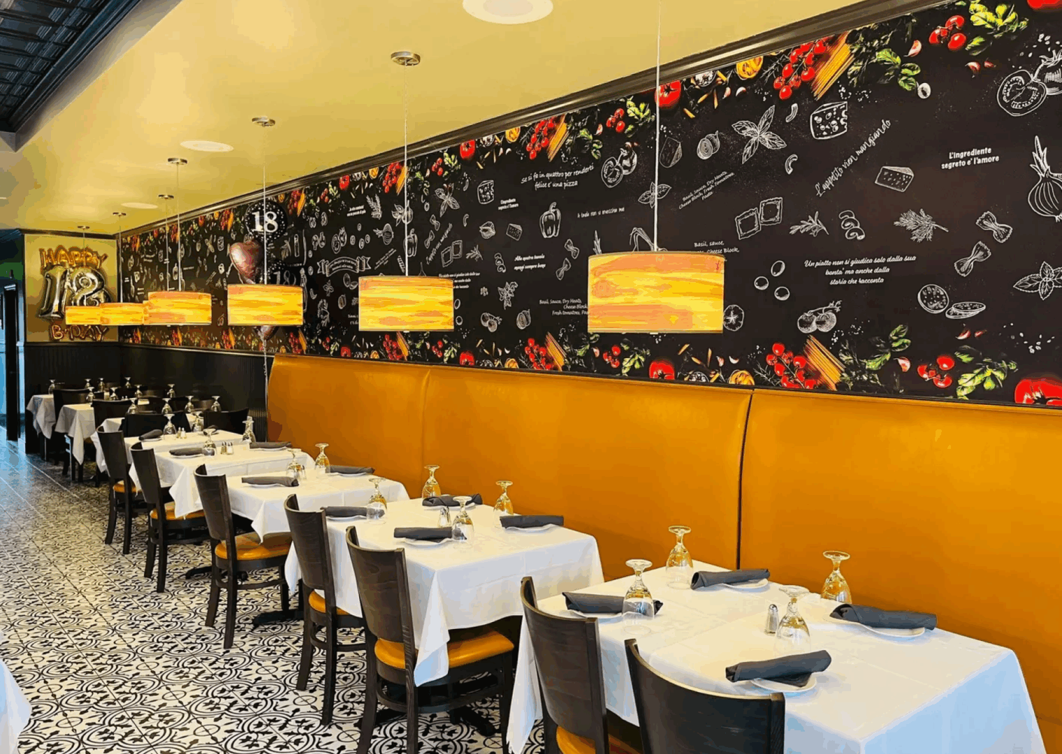 Modern restaurant with decorated blackboard wall.